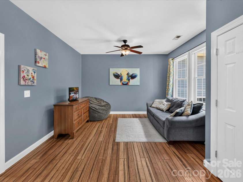 18625 The Commons Boulevard, Cornelius, NC 28031.  MLS# CAR4397710, YatesRealty ID 36310. The spacious flex/bonus room offers endless possibilities as a media room, playroom, home gym, or additional living space to fit your lifestyle.