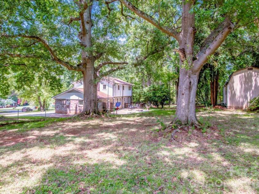 734 Willow Lane, Harrisburg, NC 28075.  MLS# CAR4401220, YatesRealty ID 36311. Backyard expansive view with lots of shade/mature trees