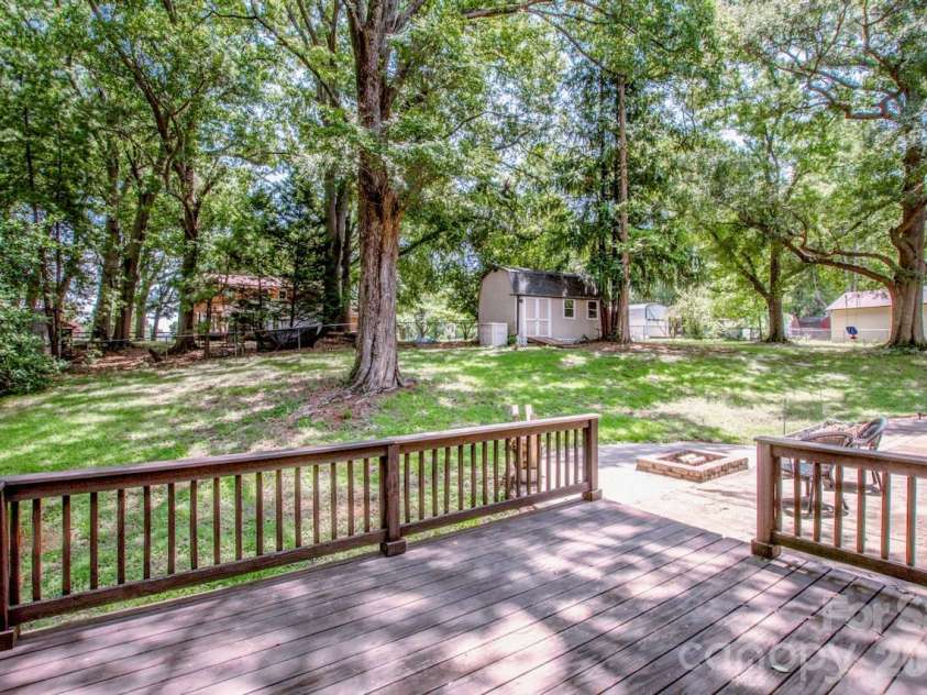 734 Willow Lane, Harrisburg, NC 28075.  MLS# CAR4401220, YatesRealty ID 36311. Backyard view from deck off dining room