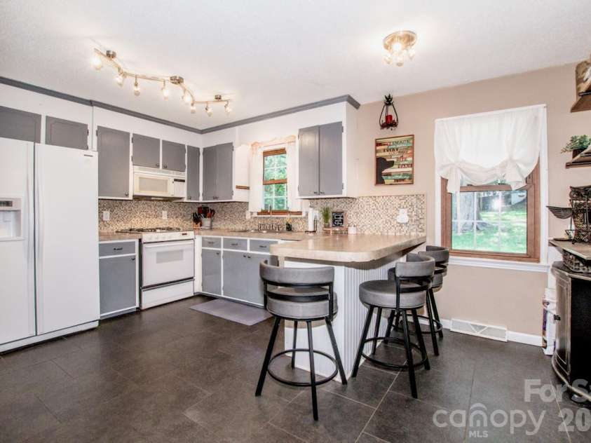 734 Willow Lane, Harrisburg, NC 28075.  MLS# CAR4401220, YatesRealty ID 36311. Kitchen with breakfast bar