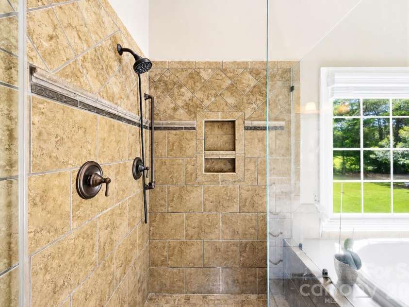 1347 Killian Road, Stanley, NC 28164.  MLS# CAR4397694, YatesRealty ID 36318. Walk in Shower in the Primary Bathroom