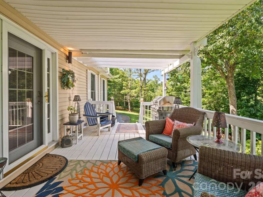 9081 Pittmans Gap Road, Newland, NC 28657.  MLS# CAR4402274, YatesRealty ID 36321. Partially covered back porch