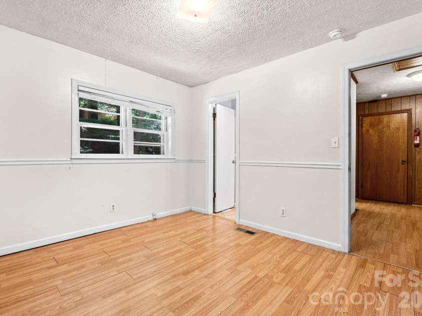 121 Horseshoe Drive, Boone, NC 28607.  MLS# CAR4402623, YatesRealty ID 36322. Bedroom 2 with ensuite