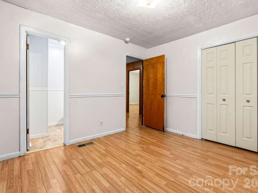 121 Horseshoe Drive, Boone, NC 28607.  MLS# CAR4402623, YatesRealty ID 36322. Bedroom 2 with ensuite bathroom