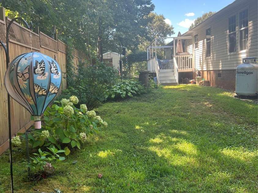 114 Ashford Drive, Olin, NC 28660.  MLS# CAR4271792, YatesRealty ID 36325. Back yard