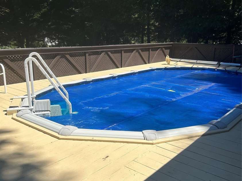 114 Ashford Drive, Olin, NC 28660.  MLS# CAR4271792, YatesRealty ID 36325. Pool with solar blanket