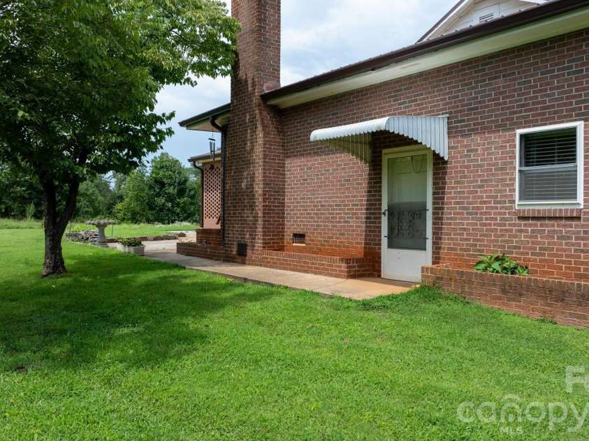 316 Drexel Road, Morganton, NC 28655.  MLS# CAR4414904, YatesRealty ID 3633. Back of home...door that accesses the laundry.