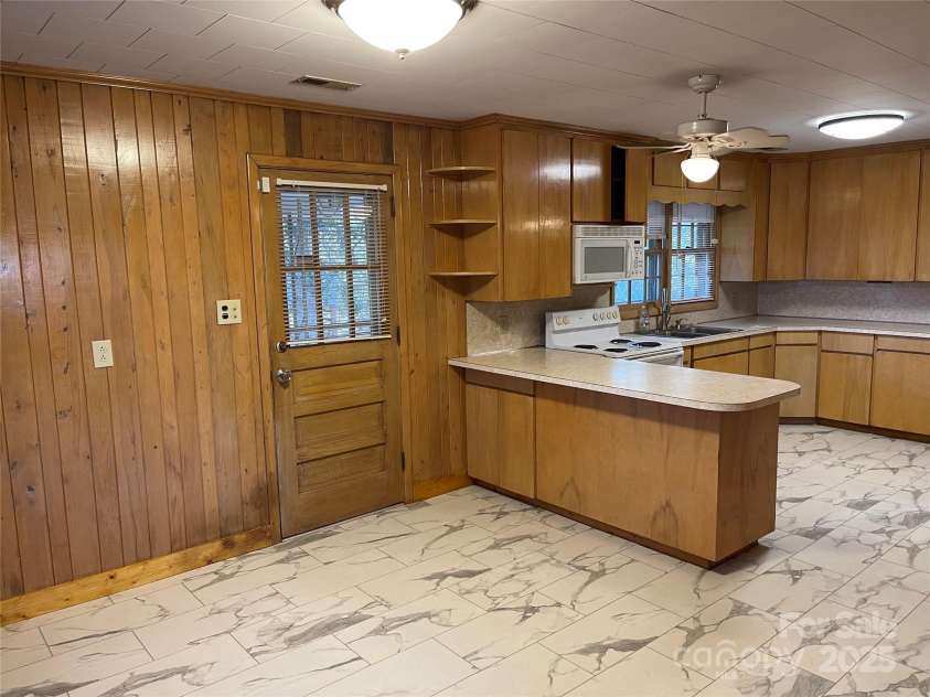 8725 Bringle Ferry Road, Salisbury, NC 28146.  MLS# CAR4218468, YatesRealty ID 3633. Side door from dining area.