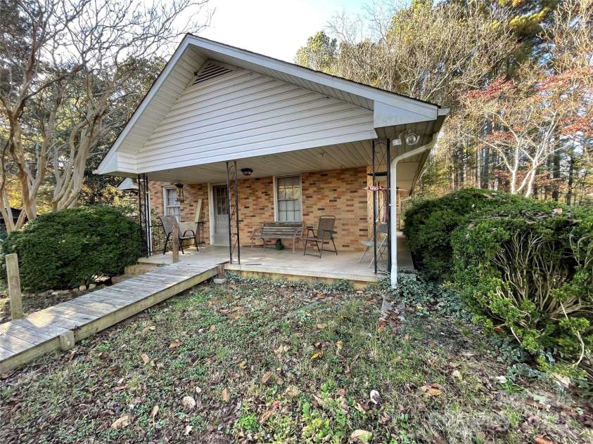 8725 Bringle Ferry Road, Salisbury, NC 28146.  MLS# CAR4218468, YatesRealty ID 3633. Side entrance with porch. Steps are under ramp