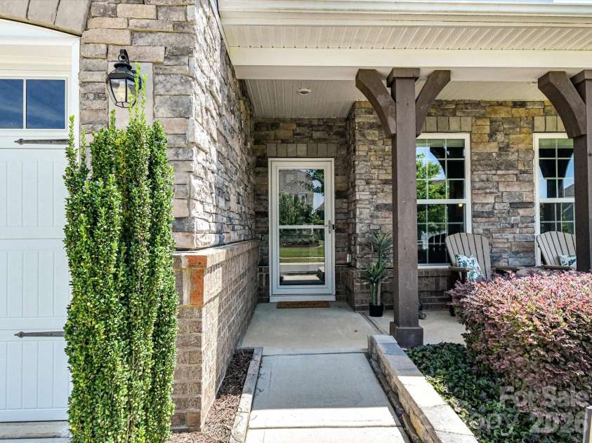 3029 Oliver Stanley Trail, Lancaster, SC 29720.  MLS# CAR4400413, YatesRealty ID 36334. Covered Front Entry with Storm Door