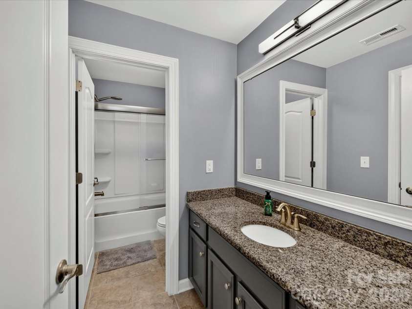 3029 Oliver Stanley Trail, Lancaster, SC 29720.  MLS# CAR4400413, YatesRealty ID 36334. Full Bath 3 Upper Level with Tiled Flooring, Granite Counters and Framed Mirrors. Upgraded Light Fixture