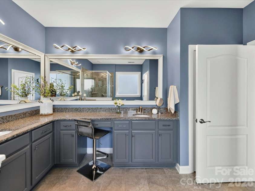 3029 Oliver Stanley Trail, Lancaster, SC 29720.  MLS# CAR4400413, YatesRealty ID 36334. Primary Bath with Framed Mirrors, Granite Counters and Modern Light Fixtures