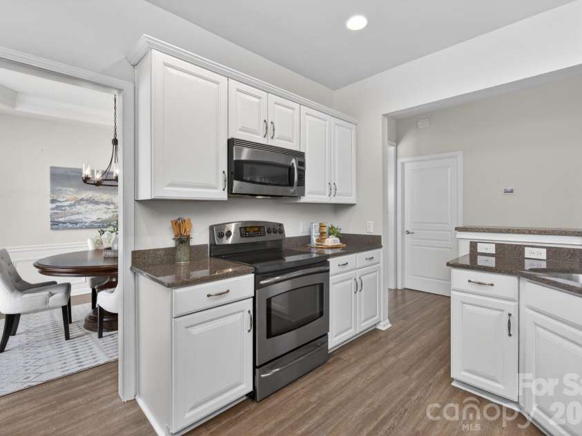 1265 Hamburg Court, Waxhaw, NC 28173.  MLS# CAR4382070, YatesRealty ID 36336. Newly painted kitchen cabinets