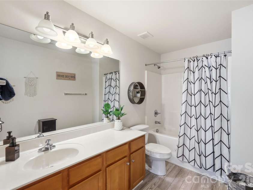 1034 Canopy Drive, Indian Trail, NC 28079.  MLS# CAR4399954, YatesRealty ID 36339. Full bath with a vanity and tub-shower combo