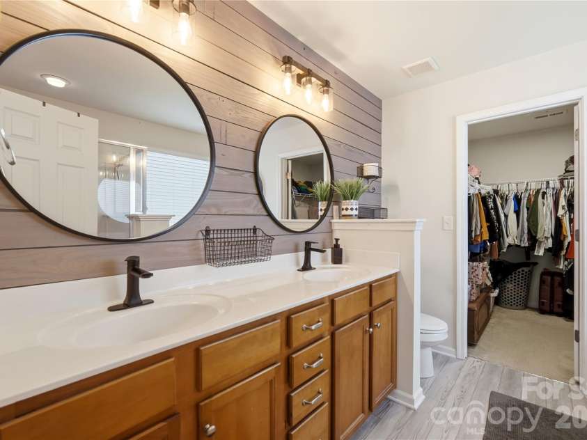 1034 Canopy Drive, Indian Trail, NC 28079.  MLS# CAR4399954, YatesRealty ID 36339. Spa-style primary bath with dual vanities