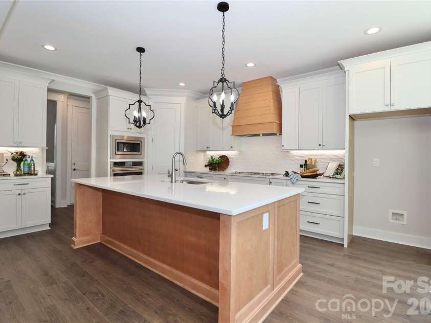 4265 Candlewood Drive, Sherrills Ford, NC 28673.  MLS# CAR4350411, YatesRealty ID 3636. A gorgeous chef-inspired kitchen with Quartz countertops featuring a large center island. Ideal for gatherings and entertainment. 