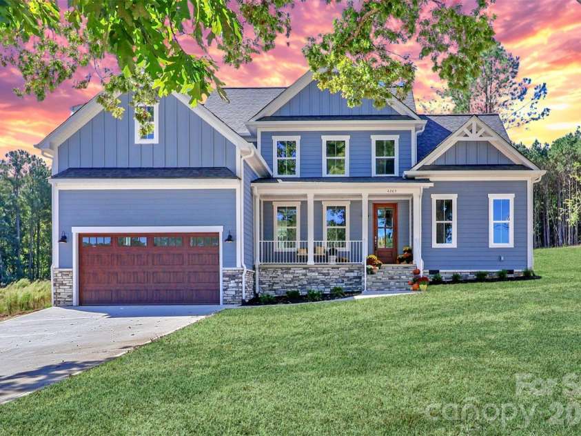4265 Candlewood Drive, Sherrills Ford, NC 28673.  MLS# CAR4350411, YatesRealty ID 3636. Beautifully crafted, new construction home featuring lake views, high-end finishes, an open-concept living space, and outdoor entertaining areas.