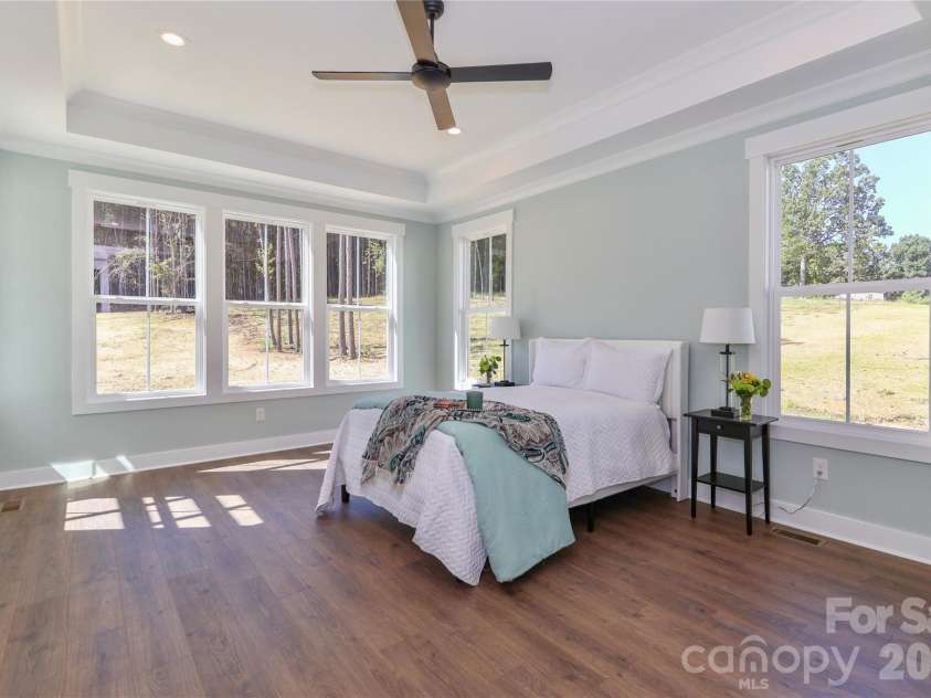 4265 Candlewood Drive, Sherrills Ford, NC 28673.  MLS# CAR4350411, YatesRealty ID 3636. Drenched in natural light, the primary bedroom is spacious, peaceful retreat, offering a tranquil escape.