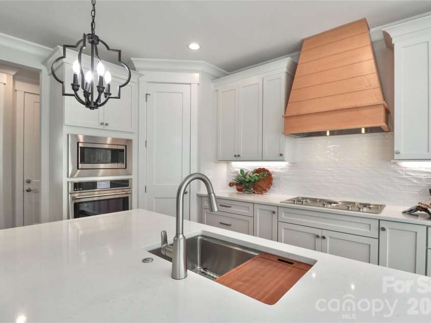 4265 Candlewood Drive, Sherrills Ford, NC 28673.  MLS# CAR4350411, YatesRealty ID 3636. Featuring stainless steel appliances with custom cabinetry.
