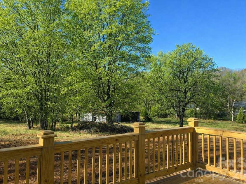 458 Allen Drive, Concord, NC 28027.  MLS# CAR4399612, YatesRealty ID 36360. Rear Deck Large Flat Backyard