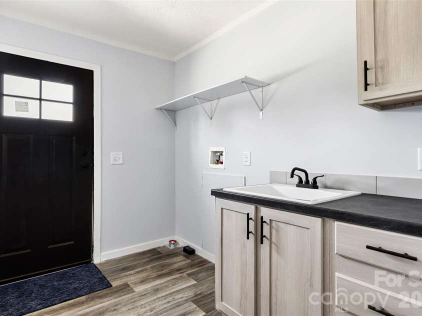 6414 Mingo Road, Heath Springs, SC 29058.  MLS# CAR4402987, YatesRealty ID 36367. Laundry room with sink & area for second Fridge