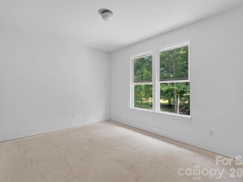 4919 Potter Road, Matthews, NC 28104.  MLS# CAR4395738, YatesRealty ID 36381. Bedroom overlooking private backyard-Lighting will be changed!