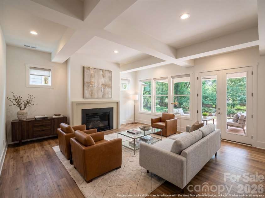 7207 Benita Drive, Charlotte, NC 28212.  MLS# CAR4389589, YatesRealty ID 36393. Representative photo- Large living room with a dramatic ceiling