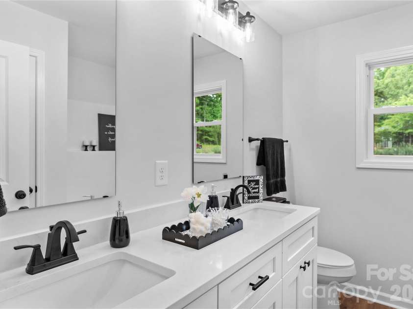 340 Swink Avenue, Salisbury, NC 28147.  MLS# CAR4403094, YatesRealty ID 36395. Two large full Baths. Main Bath with double quartz vanities.
