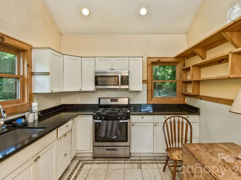 104 Pokeberry Lane, Leicester, NC 28748.  MLS# CAR4401625, YatesRealty ID 36417. Community building fully equipped kitchen