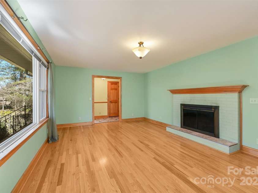 109 Balsam Road, Hendersonville, NC 28792.  MLS# CAR4187321, YatesRealty ID 3642. Living room with fireplace (includes gas logs)