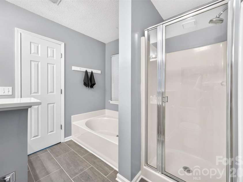 10316 Bon Meade Lane, Cornelius, NC 28031.  MLS# CAR4395622, YatesRealty ID 36425. Primary Bathroom has garden tub and separate shower