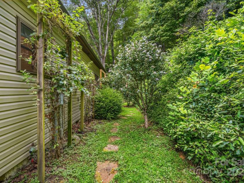 28 Back Stage Pass, Canton, NC 28716.  MLS# CAR4284833, YatesRealty ID 3643. Perennials galore!
