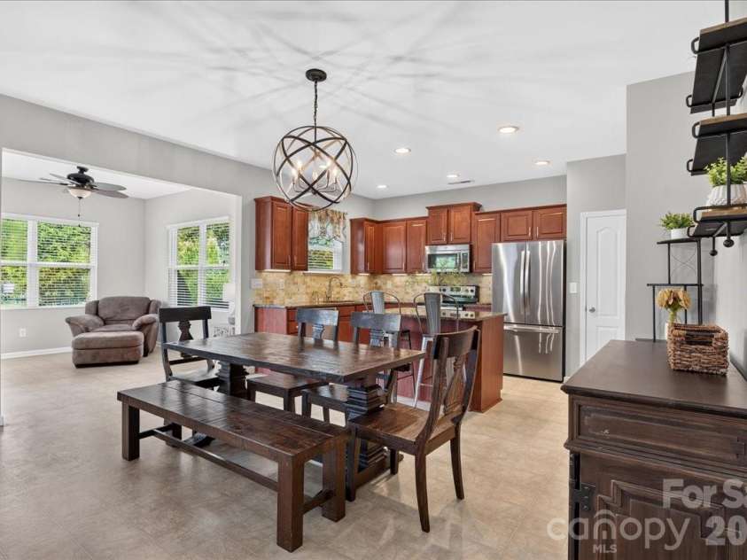 1019 Sunflower Lane, Indian Trail, NC 28079.  MLS# CAR4402543, YatesRealty ID 36431. Dining area, sunroom and kitchen