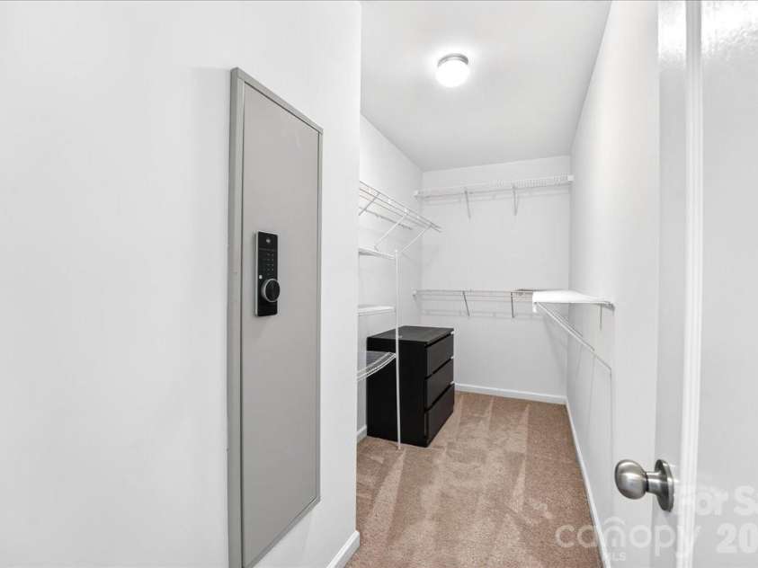 1019 Sunflower Lane, Indian Trail, NC 28079.  MLS# CAR4402543, YatesRealty ID 36431. Owner's suite walk in closet with built in safe