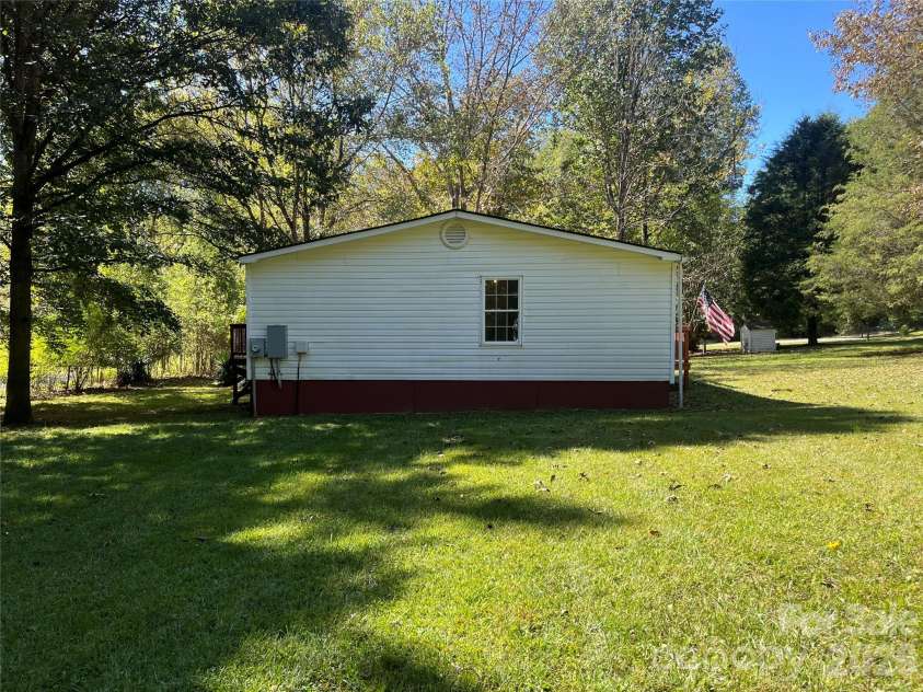 1785 Doe Court, Iron Station, NC 28080.  MLS# CAR4308568, YatesRealty ID 3644. Side view 