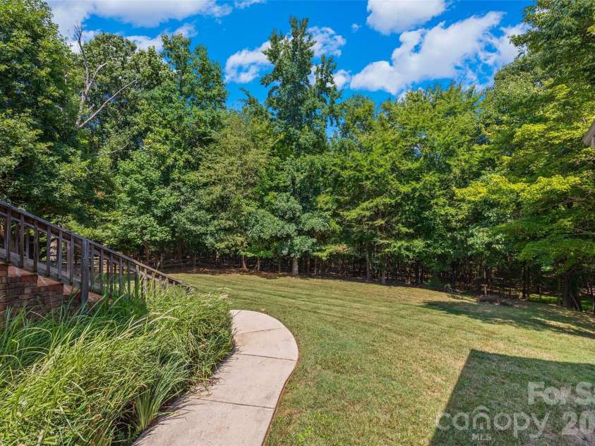 5864 Johnson Road, Clover, SC 29710.  MLS# CAR4401445, YatesRealty ID 36446. Private back yard with wildlife and well established trees