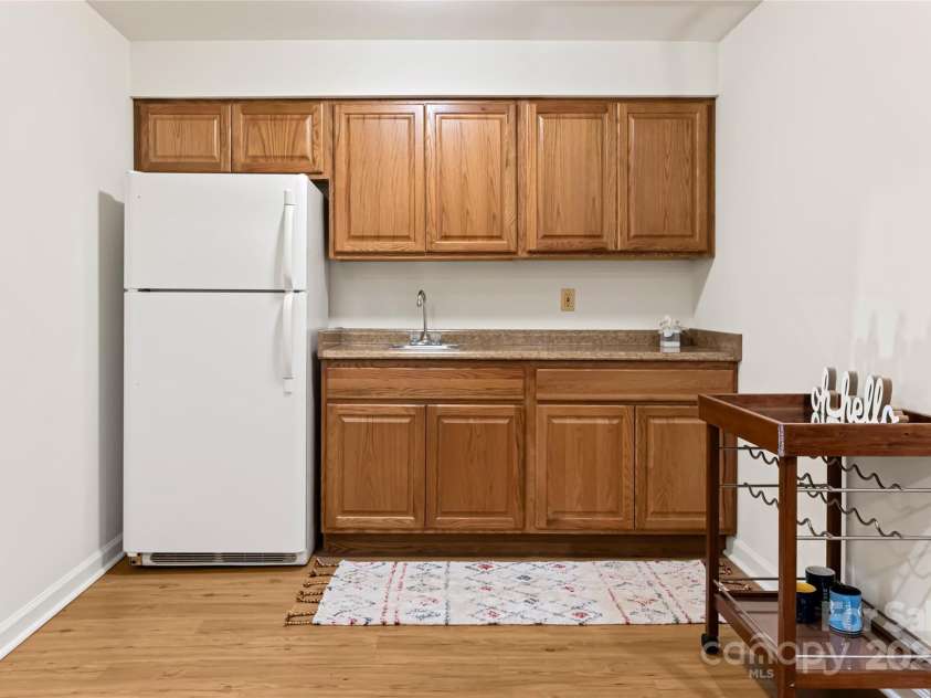21 Westridge Drive, Asheville, NC 28803.  MLS# CAR4227775, YatesRealty ID 3646. Lower level kitchenette