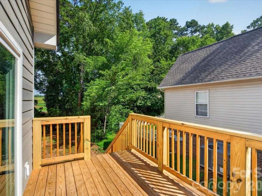 228 Hillside Avenue, Concord, NC 28025.  MLS# CAR4402795, YatesRealty ID 36476. Side Deck off Breakfast Area