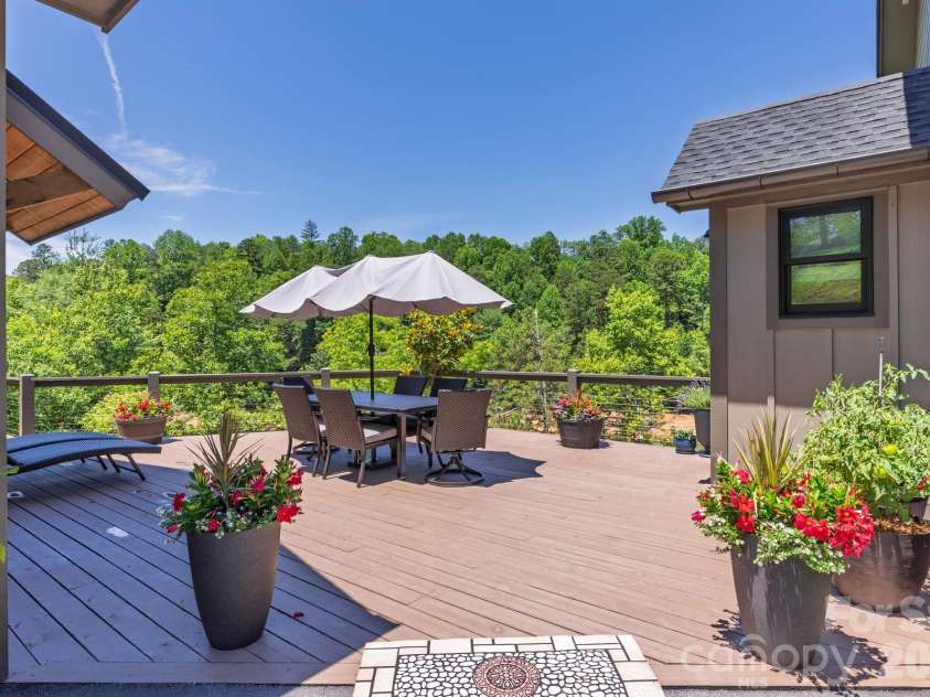 273 Alarka Point, Bryson City, NC 28713.  MLS# CAR4391193, YatesRealty ID 36534. Deck connecting Main House and 2 Car Garage