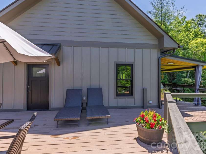 273 Alarka Point, Bryson City, NC 28713.  MLS# CAR4391193, YatesRealty ID 36534. Open Air Deck between Garage and Main House