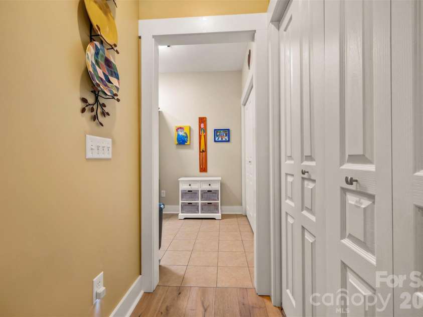 584 Summerfield Place, Flat Rock, NC 28731.  MLS# CAR4401680, YatesRealty ID 36549. Entry to mudroom from kitchen/large pantry on the right