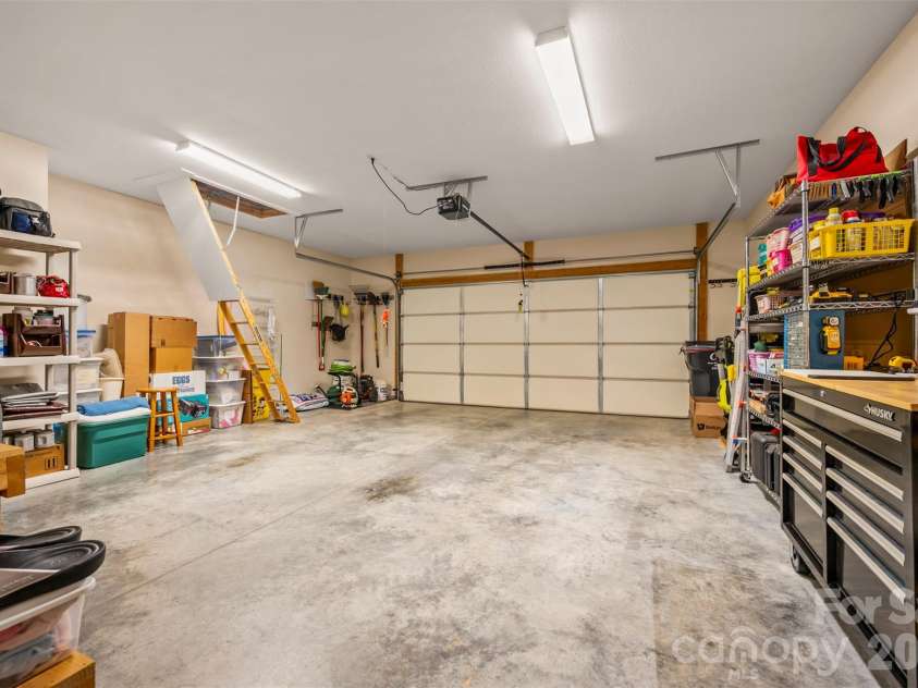 584 Summerfield Place, Flat Rock, NC 28731.  MLS# CAR4401680, YatesRealty ID 36549. Pull down attic access with floored storage above