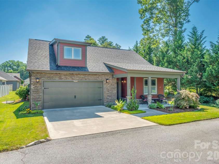 584 Summerfield Place, Flat Rock, NC 28731.  MLS# CAR4401680, YatesRealty ID 36549. Spacious two car garage with floored attic storage above
