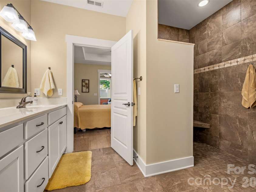 584 Summerfield Place, Flat Rock, NC 28731.  MLS# CAR4401680, YatesRealty ID 36549. Walk in shower