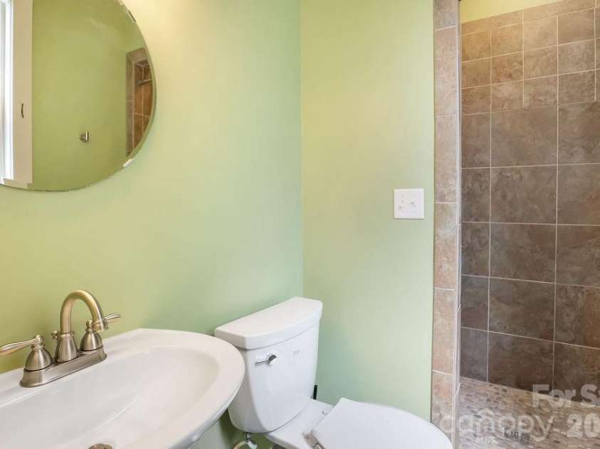 26 Mount Clare Avenue, Asheville, NC 28801.  MLS# CAR4293634, YatesRealty ID 3656. Downstairs full bath with custom shower.