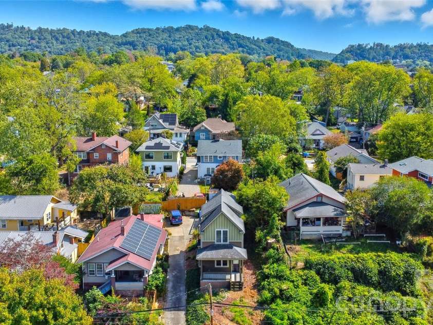 26 Mount Clare Avenue, Asheville, NC 28801.  MLS# CAR4293634, YatesRealty ID 3656. Off street parking up the shared driveway (next to the blue van in the photo).