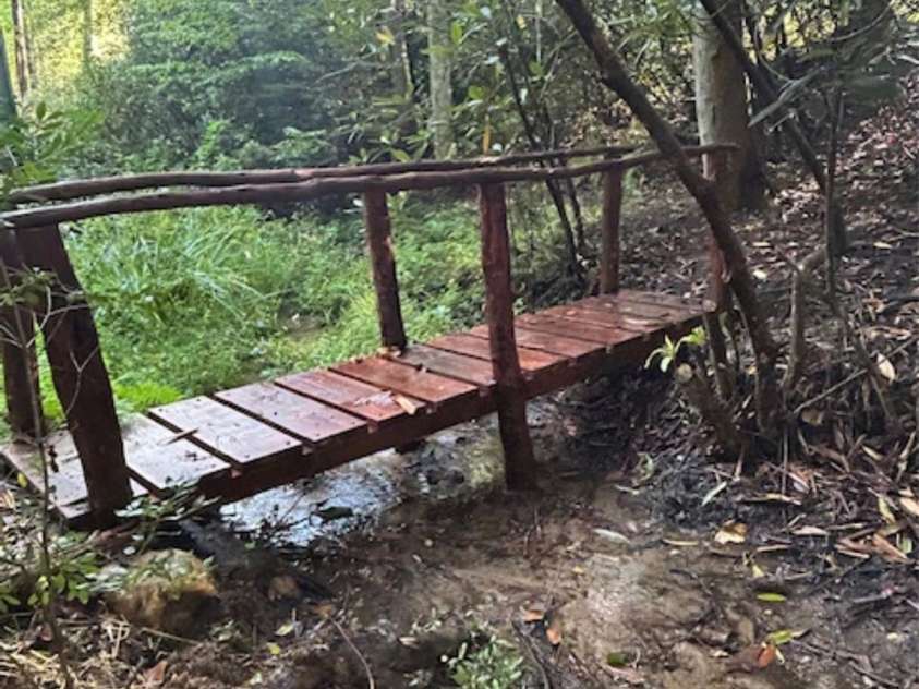 76 Azalea Court, Sapphire, NC 28774.  MLS# CAR4308118, YatesRealty ID 3657. Bridge over creek