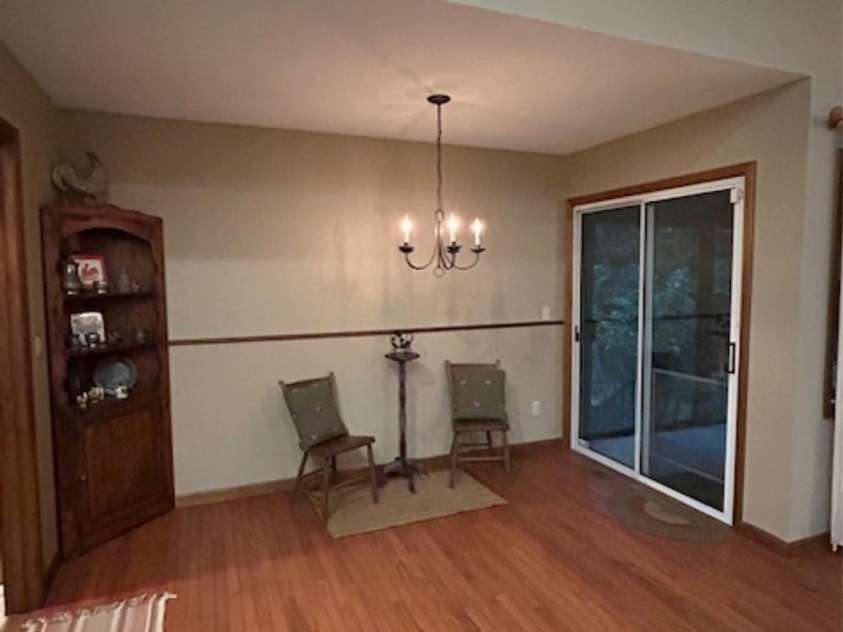 76 Azalea Court, Sapphire, NC 28774.  MLS# CAR4308118, YatesRealty ID 3657. Dining area with sliding door to sun room