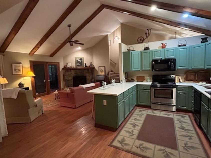 76 Azalea Court, Sapphire, NC 28774.  MLS# CAR4308118, YatesRealty ID 3657. Kitchen and living room 
