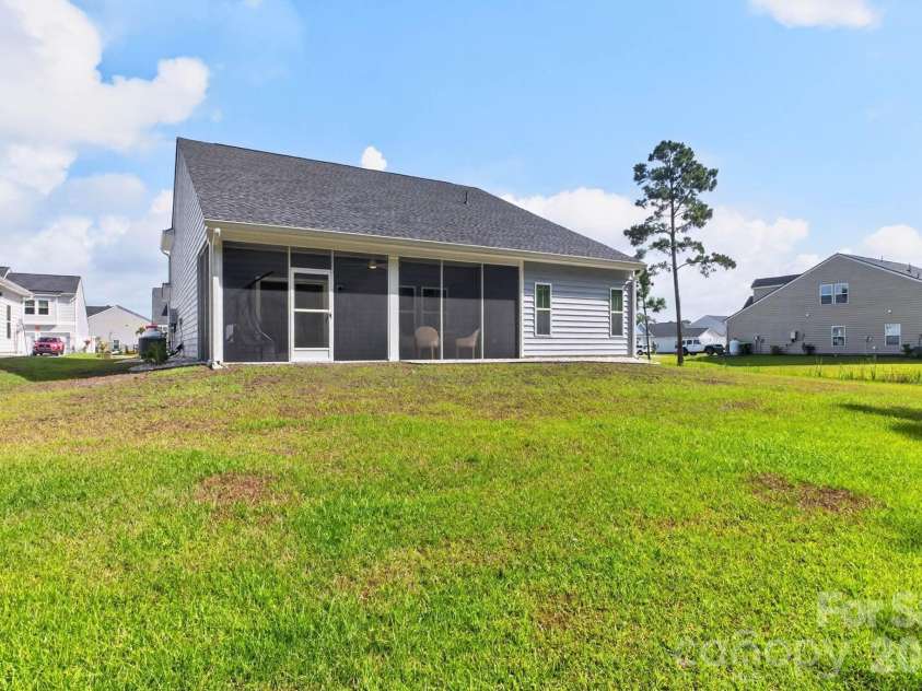 9205 Little Osprey Drive, Calabash, NC 28467.  MLS# CAR4398184, YatesRealty ID 36576. Rear elevation